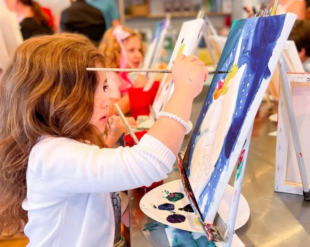 a young girl painting