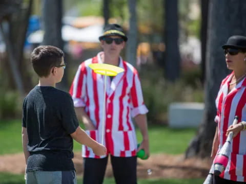 a group of people playing frisbee
