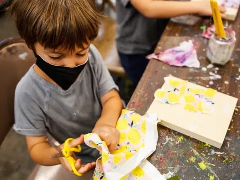 a young boy painting