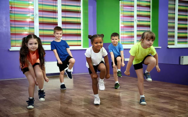 a group of children sitting on the floor