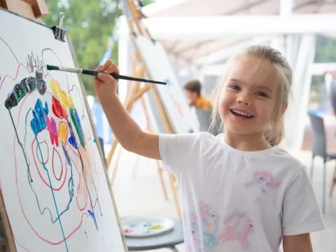 a young girl painting