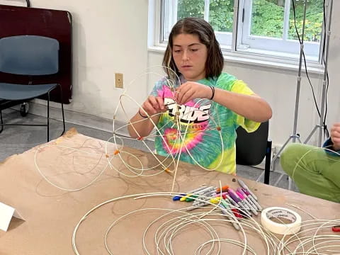 a girl holding a toy