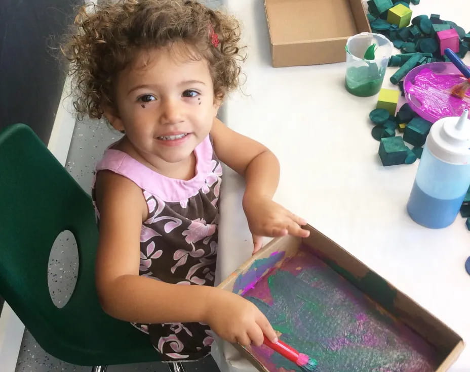 a child sitting at a table