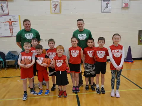 a group of kids in a gym