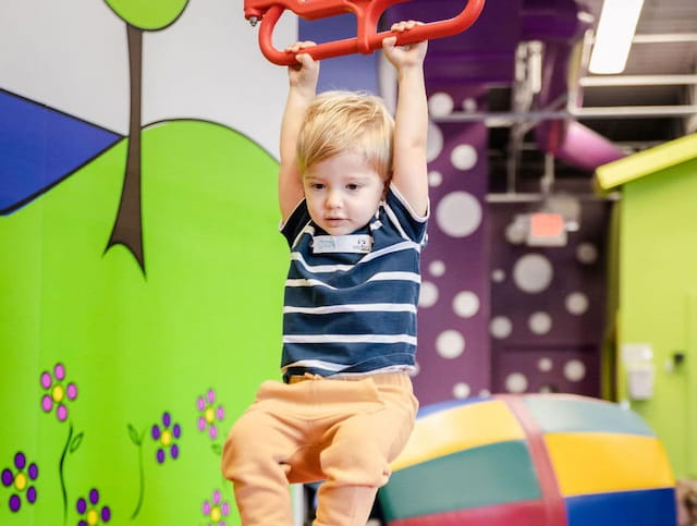 a child holding a toy