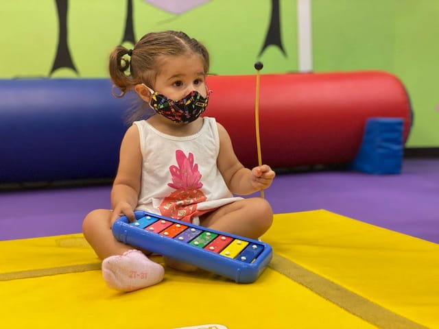 a baby playing with a toy