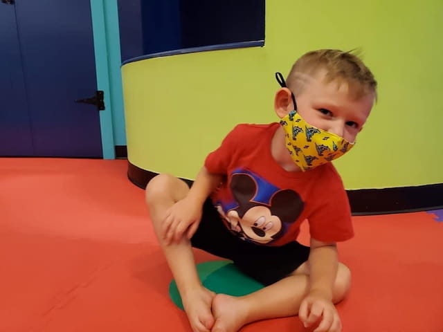 a boy sitting on the floor
