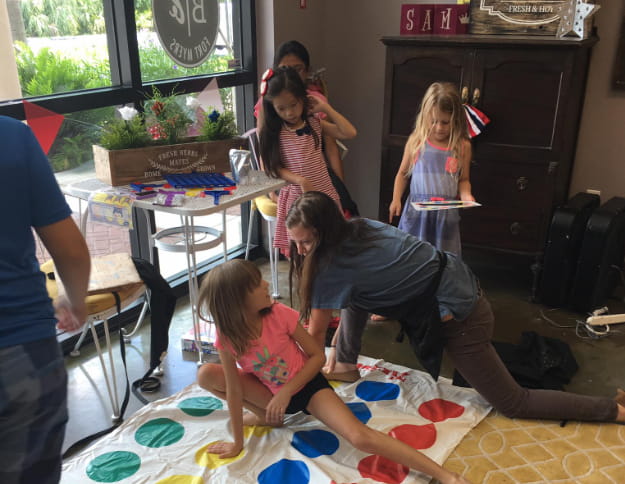 a group of people playing with toys
