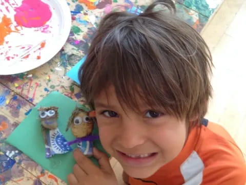 a boy smiling at the camera