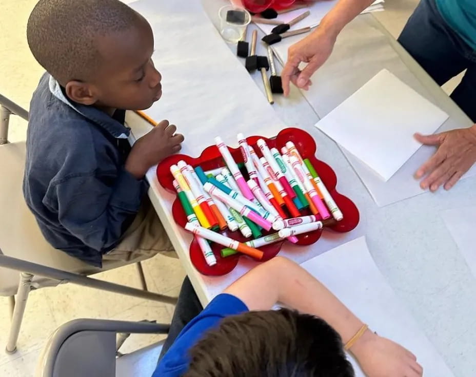 a child sitting at a table
