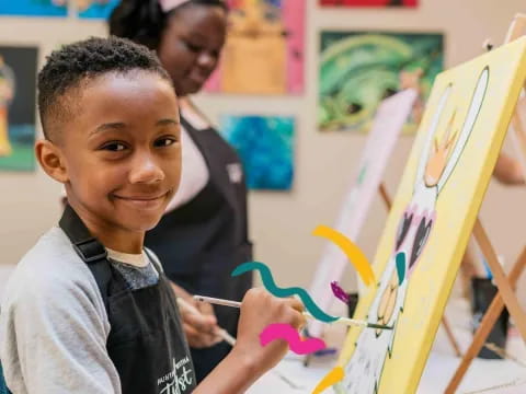 a boy holding a pencil