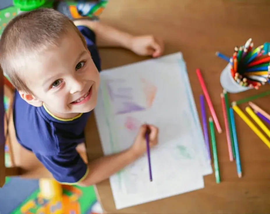 a child sitting at a table