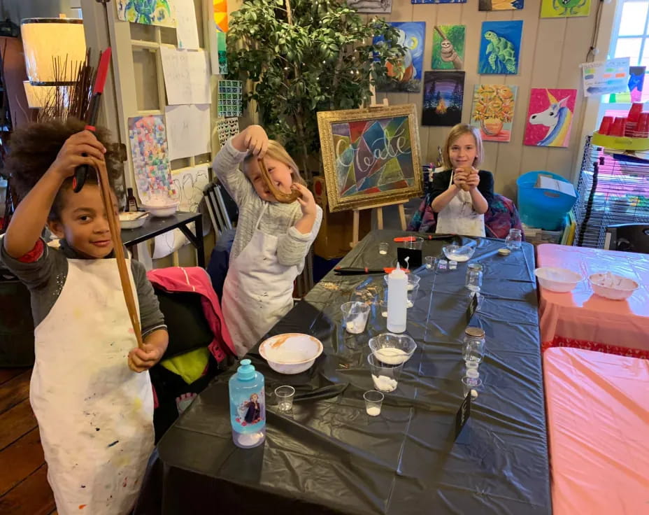 a group of girls in white dresses