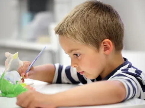 a young boy eating ice cream