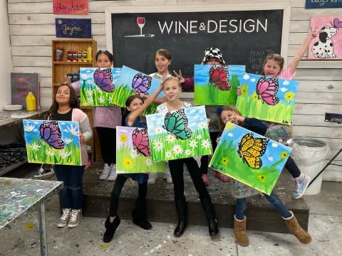 a group of people holding kites