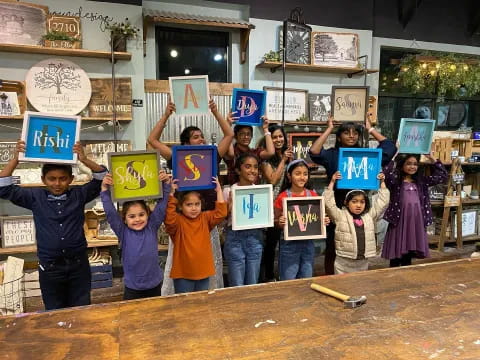 a group of children holding signs