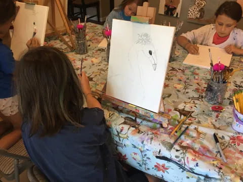 a group of children painting