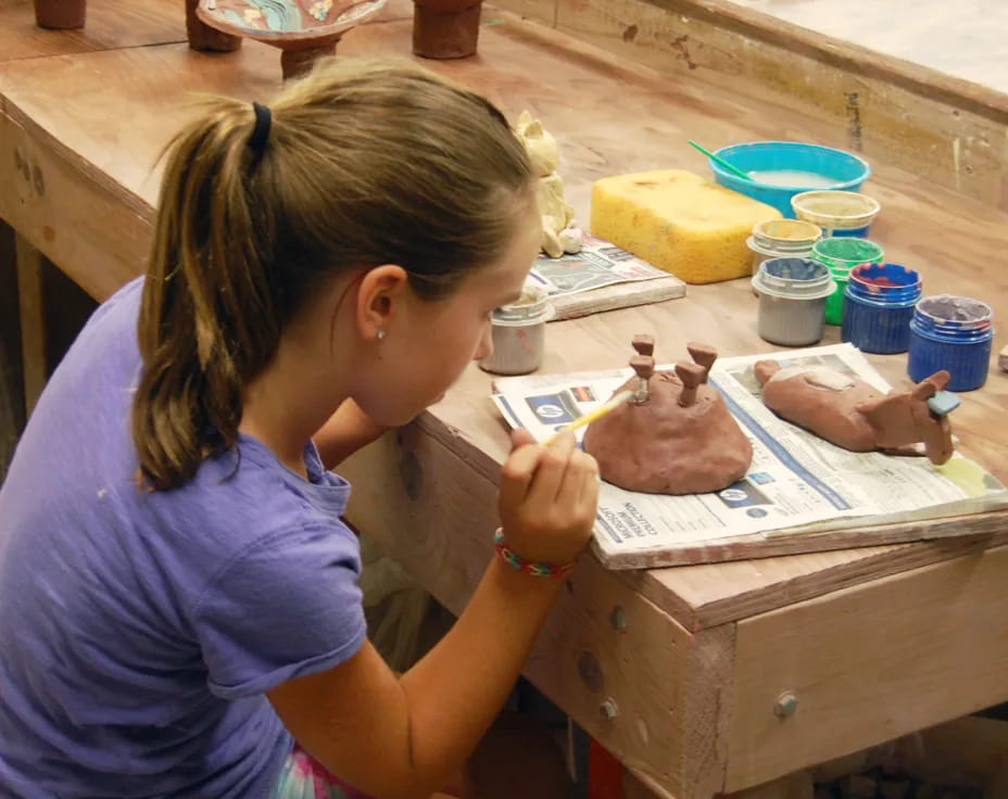 a young girl painting
