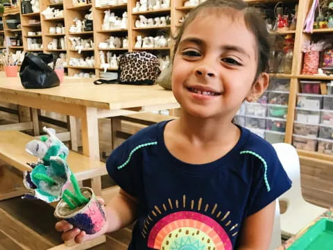 a child holding a toy