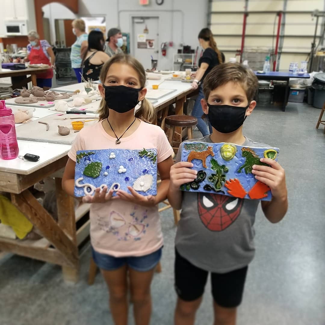 a couple of girls wearing masks