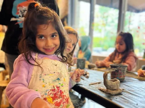 a girl sitting at a table