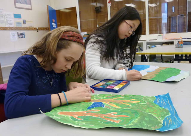 a few young girls painting