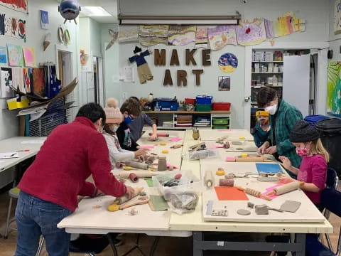 a group of people working in a classroom