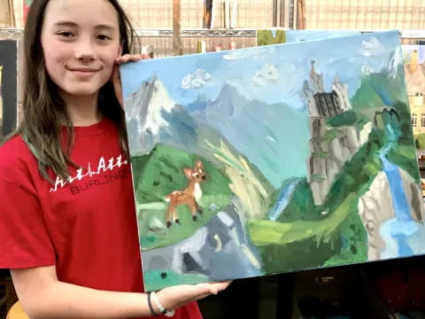 a person holding a painting