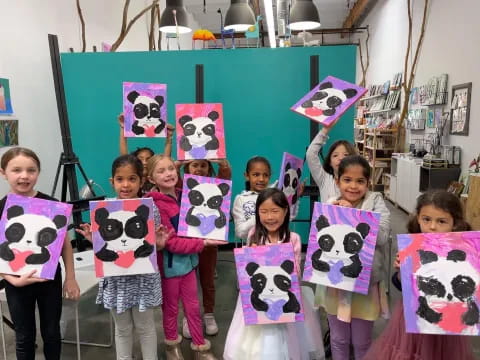 a group of children holding signs