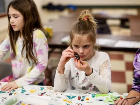 a few young girls painting