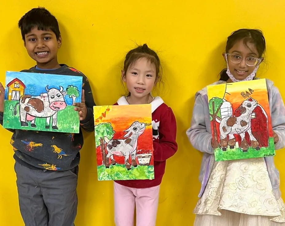 a group of children holding books