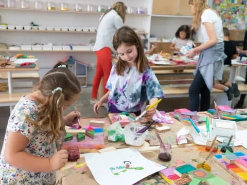 a group of children painting