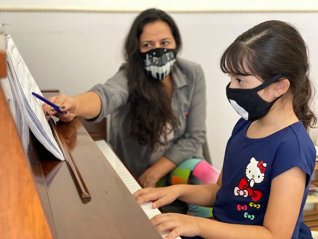 a person and a child wearing masks