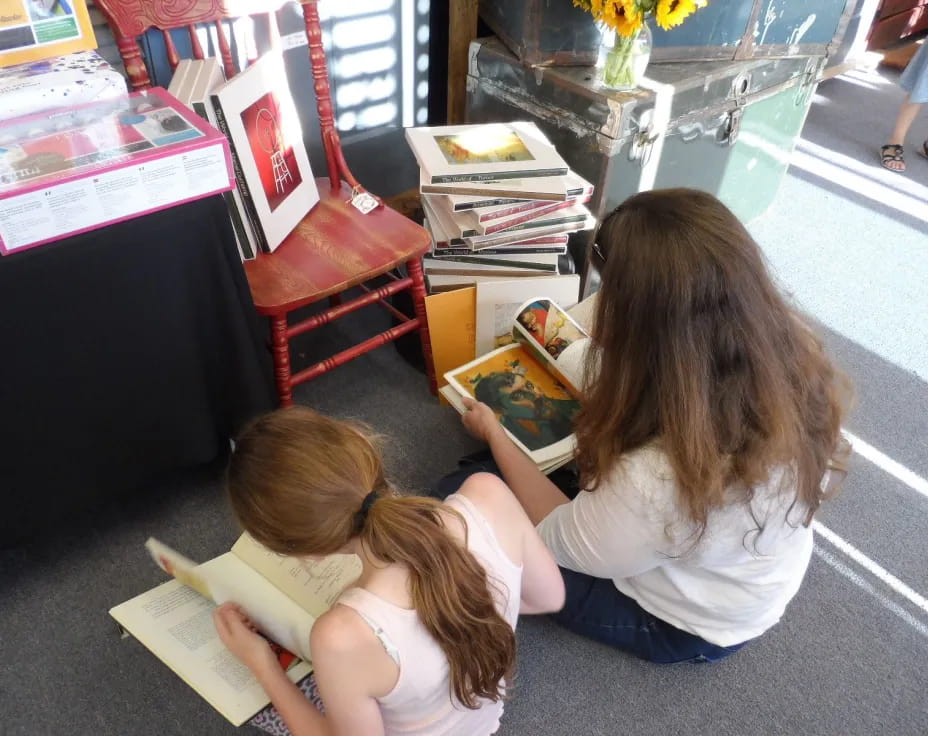a couple of girls reading books