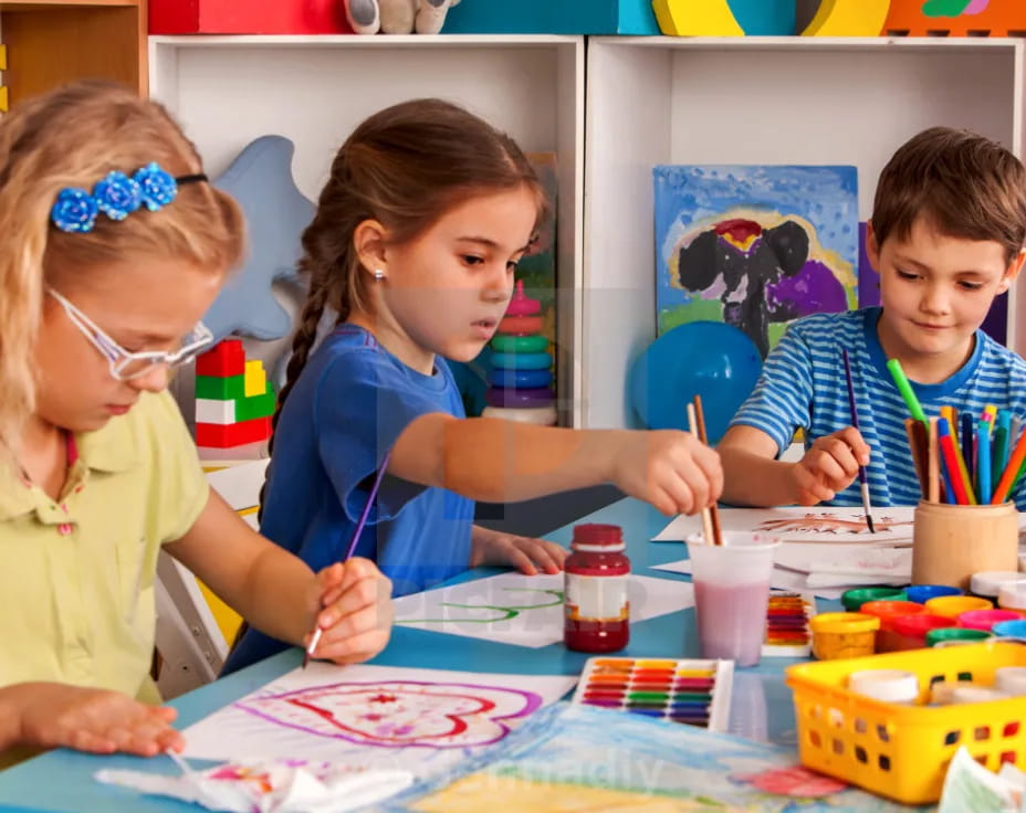 a group of children painting