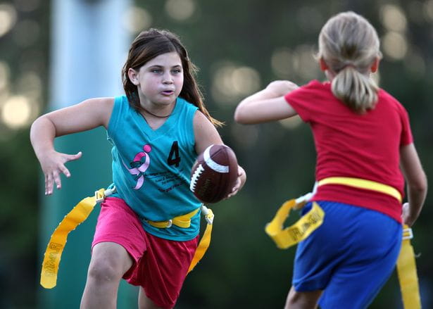 a person running with a ball