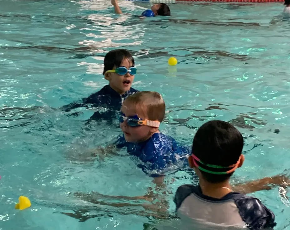 a group of people in a pool