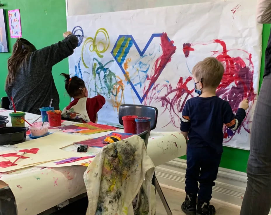 a group of children painting