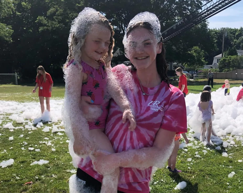 a person holding a child