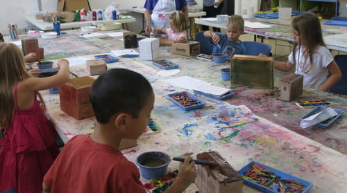 children painting on the floor