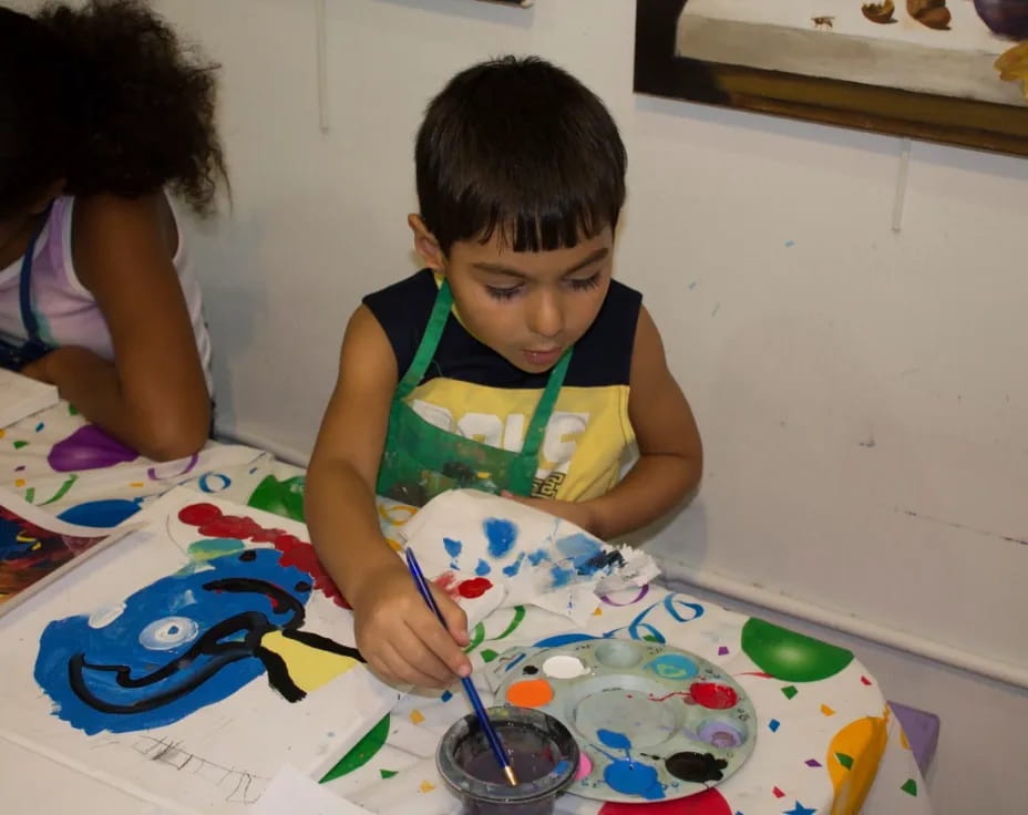 a young boy painting