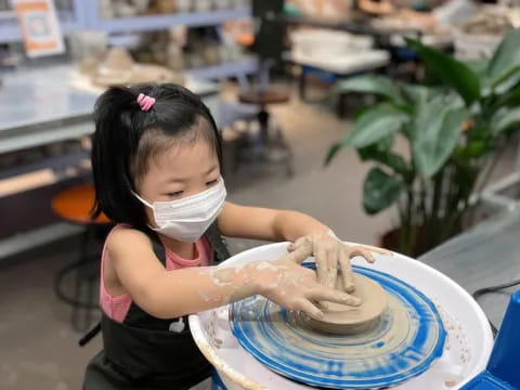 a young girl wearing a mask