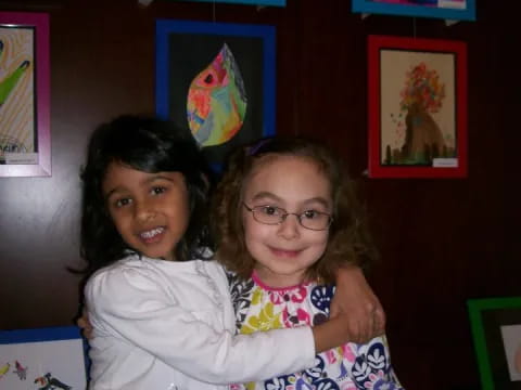 a person holding a girl