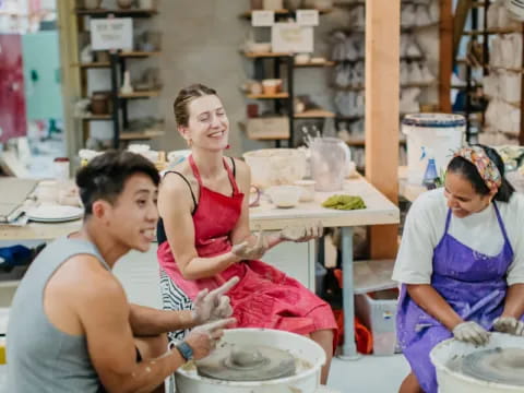 a group of people cooking in a kitchen