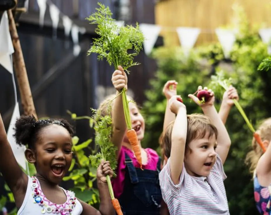 a group of children holding flowers