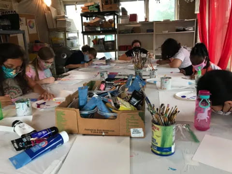 a group of children sitting at a table