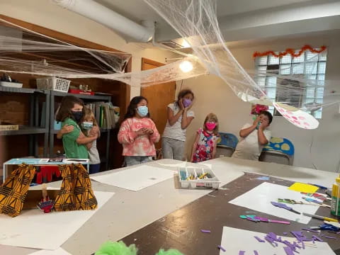 a group of people wearing masks