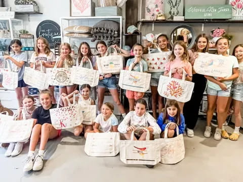 a group of children holding signs
