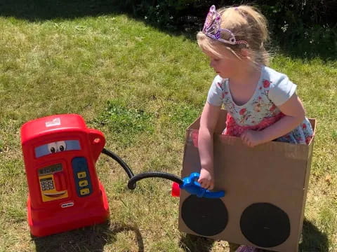 a little girl playing with a toy