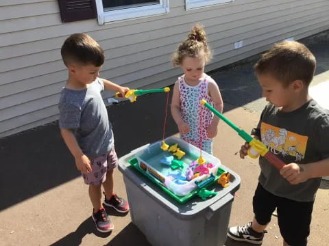 kids playing with a cake